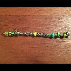 Silver pandora bracelet with all green charms